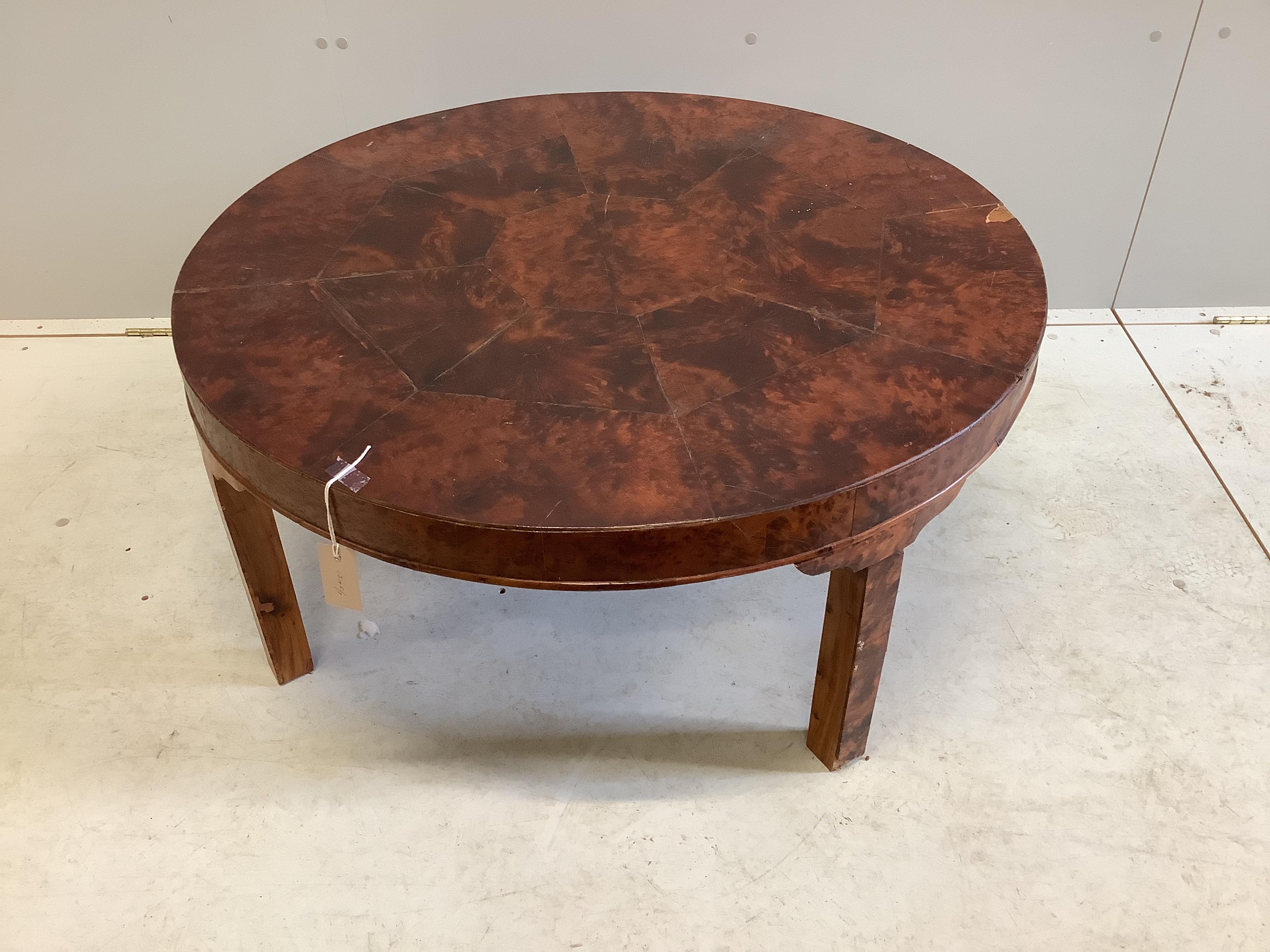 A circular amboyna coffee table, diameter 91cm, height 40cm